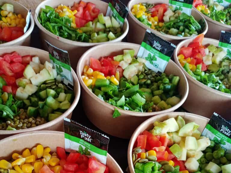 Multiple bowls of salad arranged together.